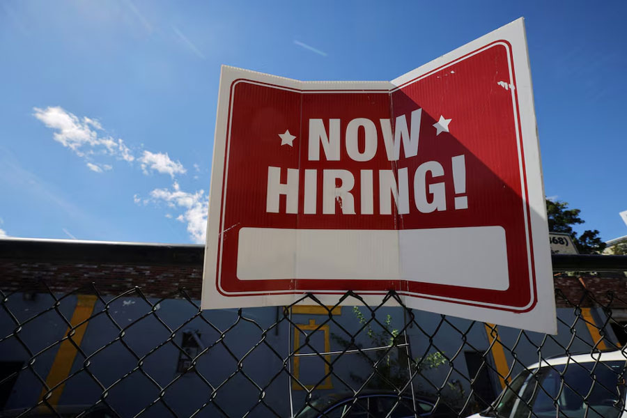 A "now hiring" sign is displayed outside Taylor Party and Equipment Rentals in Somerville, Massachusetts, US, September 1, 2022.