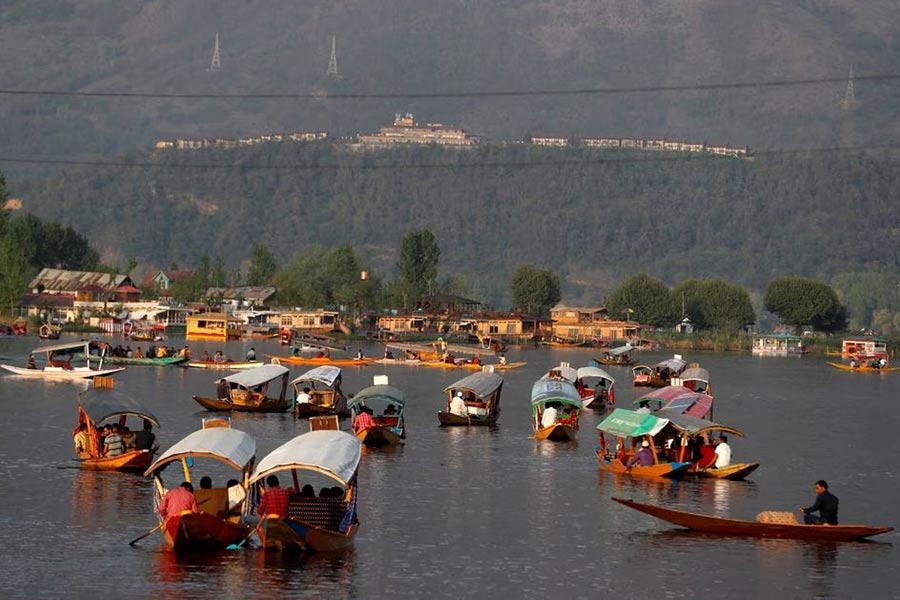 Tourists riding boats in the waters of Dal Lake in Srinagar on April 5 in 2022 –Reuters file photo