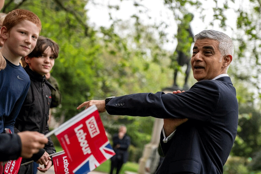 Mayor of London Sadiq Khan reacts during a photo-call with supporters the day before voters go to the polls in the London Mayoral elections in London, Britain May 1, 2024.