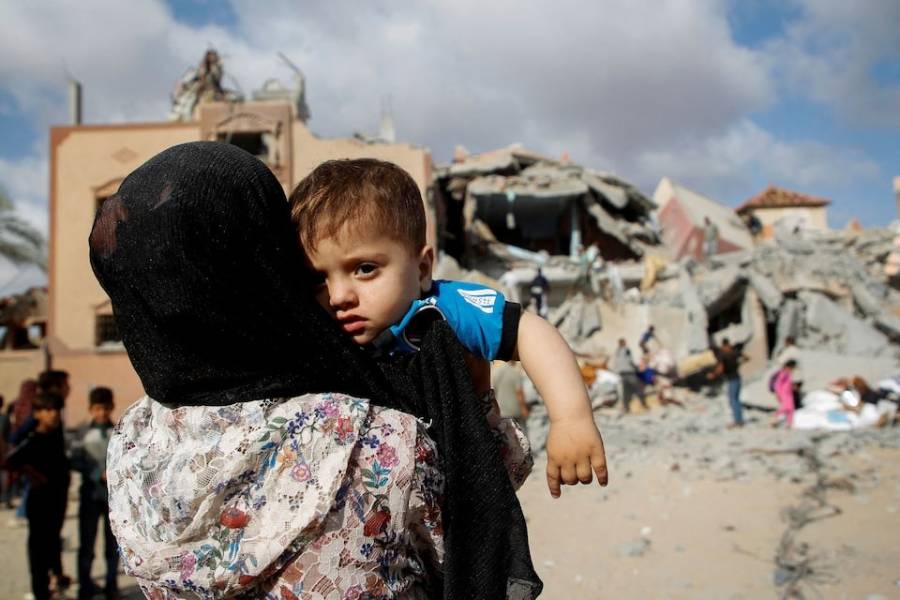 A Palestinian child looks on at the site of an Israeli strike on a house in Rafah, May 5, 2024.