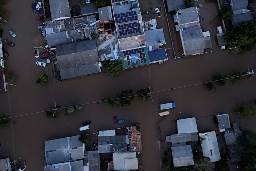 A drone view shows the Brazilian flag painted on a house as streets are flooded in Eldorado do Sul, Rio Grande do Sul state, Brazil, May 9, 2024.