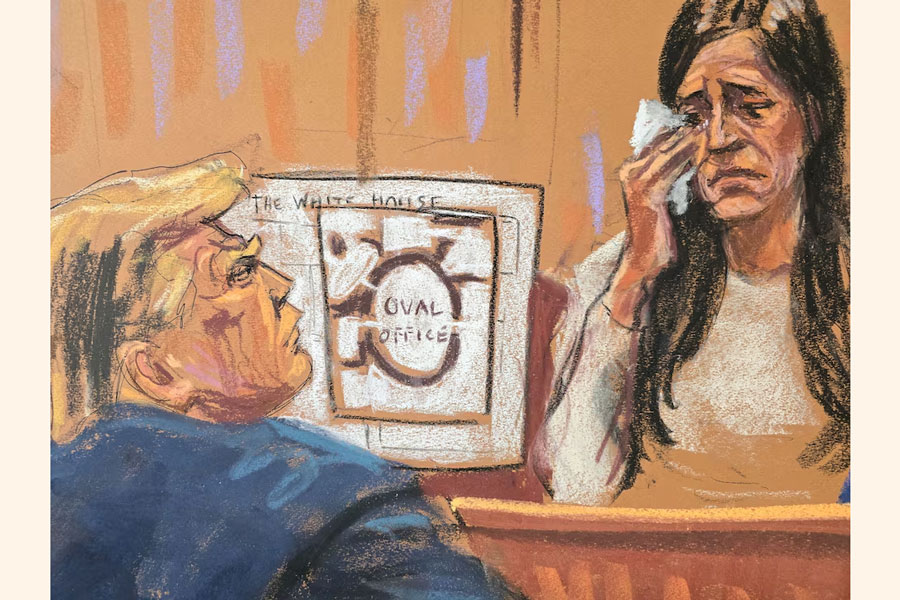 Former U.S. President Donald Trump watches as Former Director of Oval Office Operations Madeleine Westerhout testifies during his criminal trial on charges that he falsified business records to conceal money paid to silence porn star Stormy Daniels in 2016, in Manhattan state court in New York City, U.S., May 9, 2024 in this courtroom sketch.