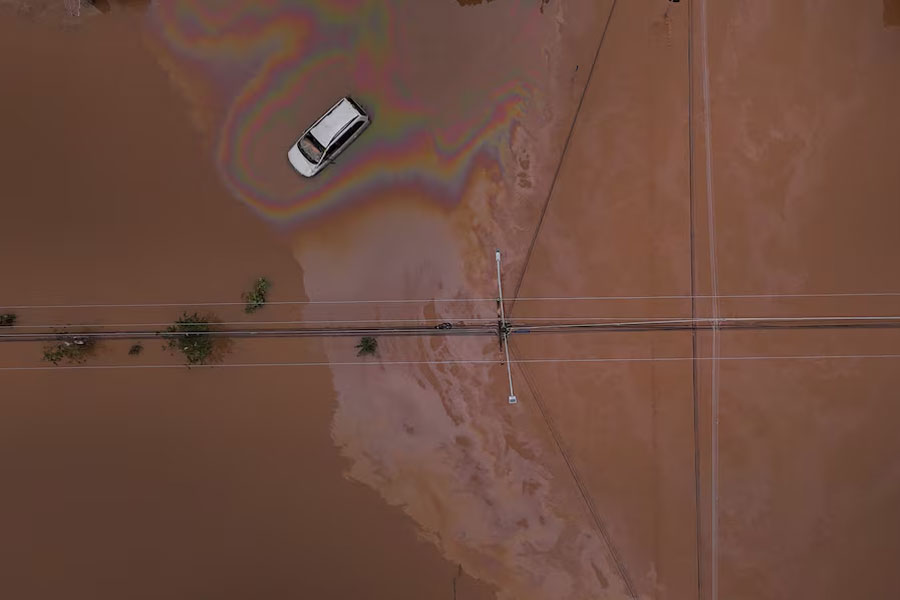 A drone view shows a car on a flooded street in Eldorado do Sul, Rio Grande do Sul state, Brazil, May 10, 2024.