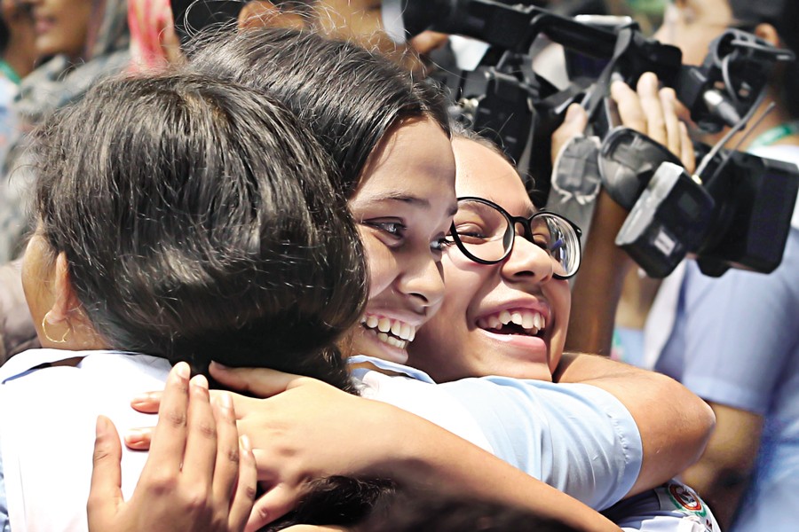 Viqarunnisa Noon School & College Bailey Road campus students beam with joy as they hug classmates to celebrate their outstanding achievements following the publication of the Secondary School Certificate (SSC) results. Once again, girls in 2024 outshined boys in pass rates and the number of GPA 5 achievers. —FE Photo by Shafiqul Alam