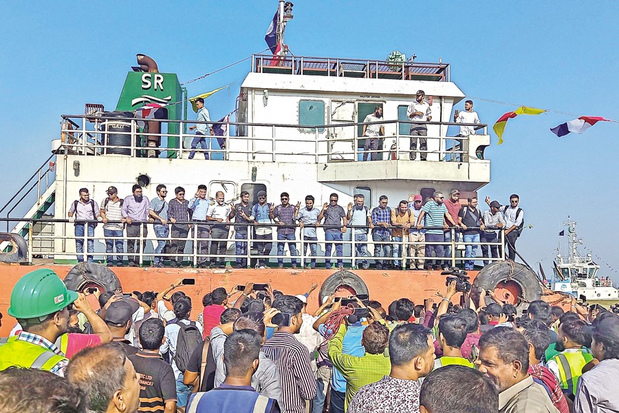 Family members greet the crew of MV Abdullah ship upon their arrival at the Chittagong Port in Chattogram on Tuesday, following their release by the Somali pirates. — AFP
