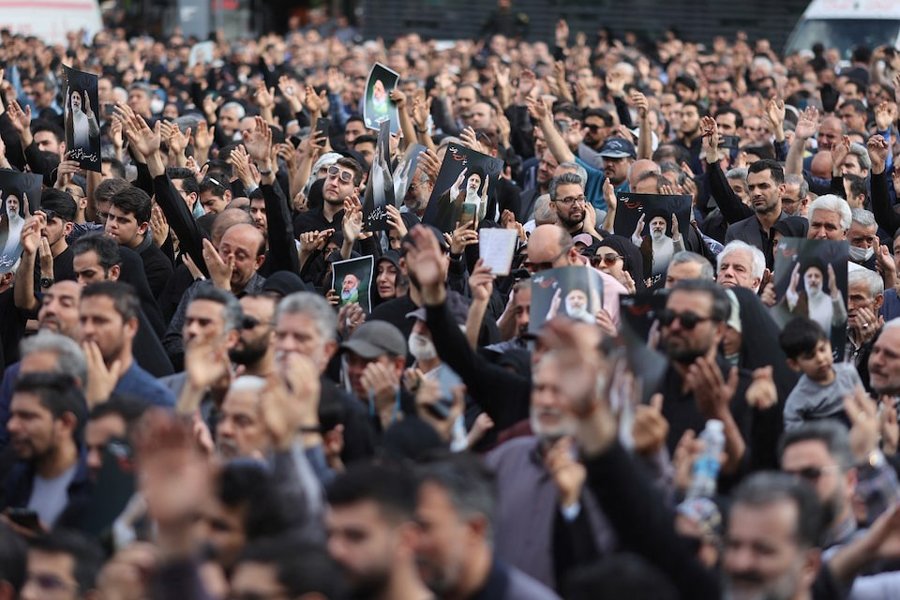People gather to mourn for the death of the late Iran's President Ebrahim Raisi, in Tehran, Iran May 20, 2024.