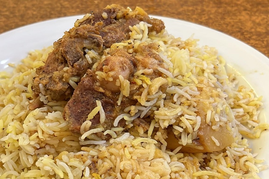 Kacchi is perfectly slow-cooked with layers of partially cooked rice, shallow-fried potatoes, and marinated raw mutton in a sealed pot