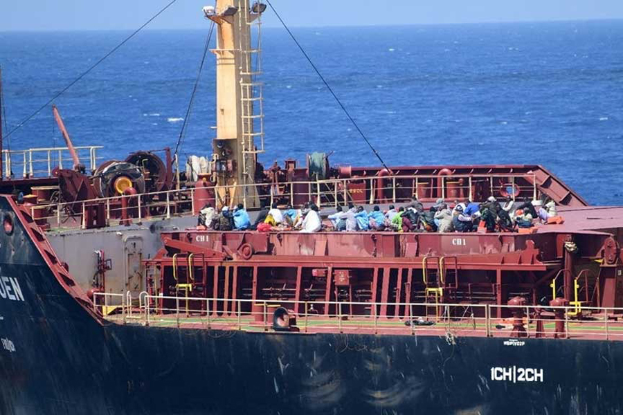 Pirates detained by the Indian navy during a rescue operation for the hijacked ship MV Ruen sit on the deck in this handout image released on Mar 16, 2024.