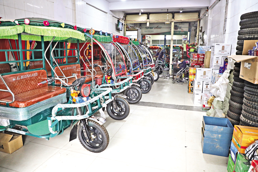 Battery-run auto-rickshaws and spare parts are on display at a showroom of Bir Sherestha Shaheed Shipahi Mostafa Kamal Stadium Market at Kamlapur in Dhaka. — FE Photo