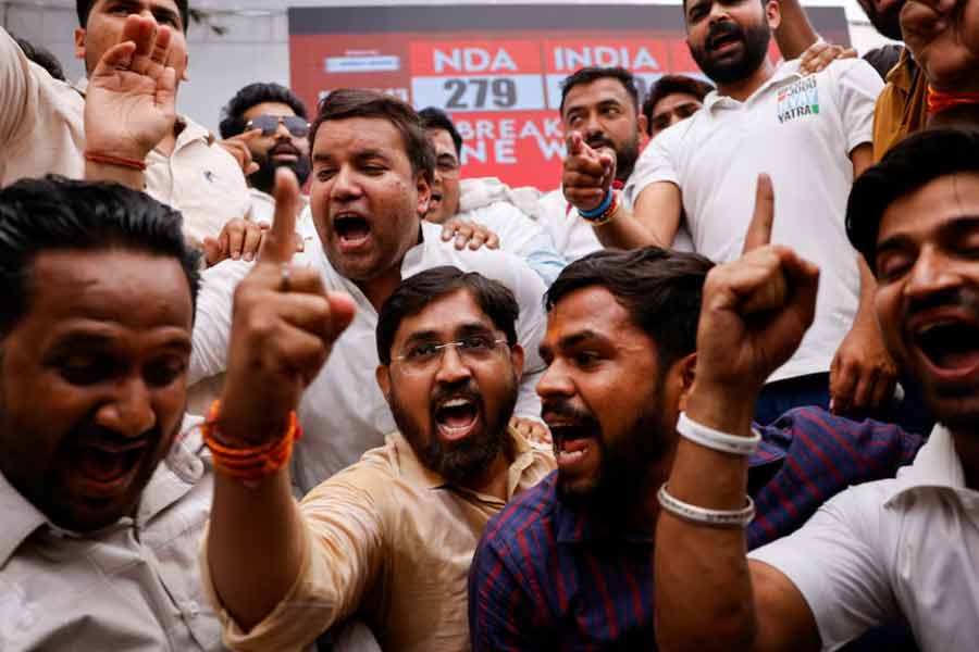 Indian National Congress (INC) supporters reacting to initial general election results at the party headquarters in New Delhi on Tuesday –Reuters photo