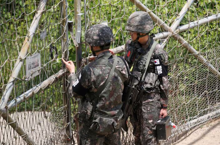 South Korean soldiers lock a gate at a guard post near the the demilitarized zone (DMZ) separating the two Koreas, in Paju, South Korea, June 17, 2020. REUTERS/Kim Hong-Ji
