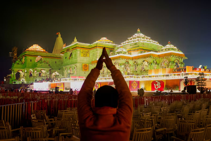 A Hindu devotee prays near the Lord Ram temple after its inauguration, in Ayodhya, India, January 22, 2024.