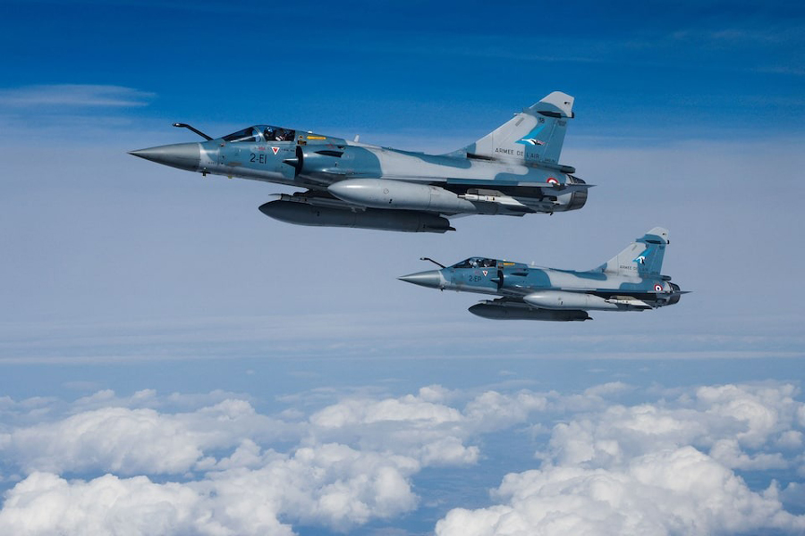 Two Mirage 2000-5F fighter jets of the French Air Force are seen next to an Airbus A330 MRTT “Phenix” in the airspace of Poland as part of NATO’s enhanced Air Policing (eAP) to secure the skies over Baltic allies, March 29, 2022.