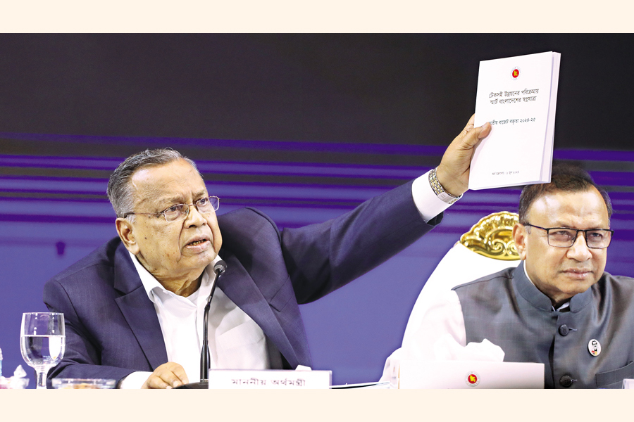 Finance Minister Abul Hassan Mahmood Ali makes a gesture during a post-budget press conference at the Osmani Memorial Auditorium in Dhaka on Friday. — FE Photo by Shafiqul Alam