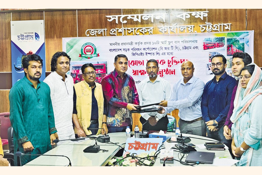 BRTC Sub-depot Manager Zulfikar Ali and GPH Ispat Adviser Shaukat Osman exchanging document after signing the MoU at a programme at the Deputy Commissioner's office in Chattogram on Thursday.