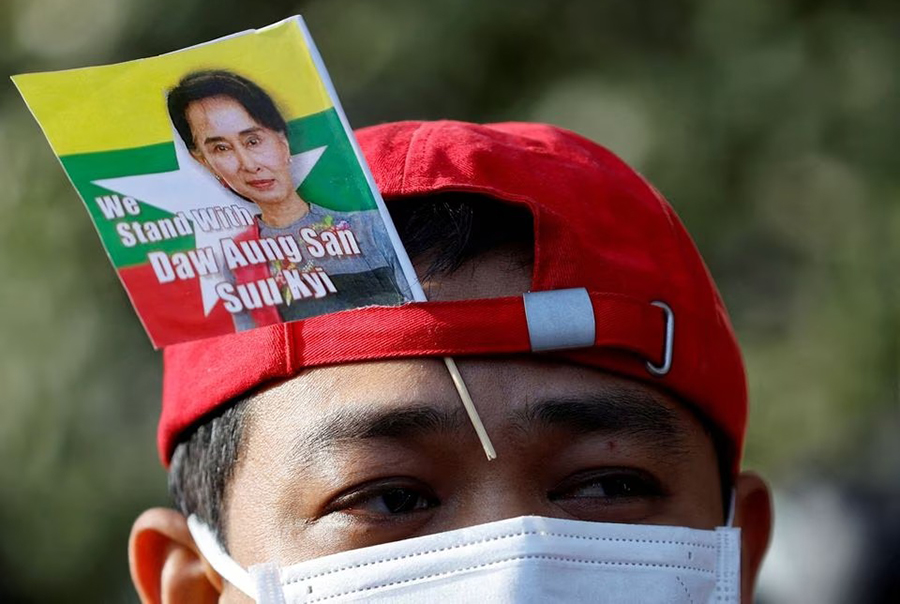 A Myanmar protester residing in Japan uses a flag with an image of deposed Myanmar leader Aung San Suu Kyi during a rally to mark the second anniversary of Myanmar's 2021 military coup, outside the Embassy of Myanmar in Tokyo, Japan on February 1, 2023 — Reuters/Files
