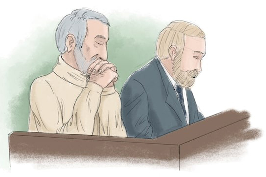 Hamid Noury, who is accused of involvement in the massacre of political prisoners in Iran in 1988, sits with attorney Thomas Soderqvist, during his trial, in this courtroom sketch, in Stockholm District Court, Sweden November 23, 2021.