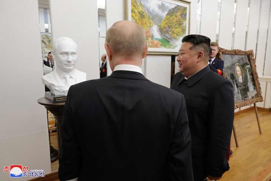 Russia's President Vladimir Putin talking with North Korea's leader Kim Jong Un during his state visit to North Korea in this image released by the Korean Central News Agency on Thursday –Reuters