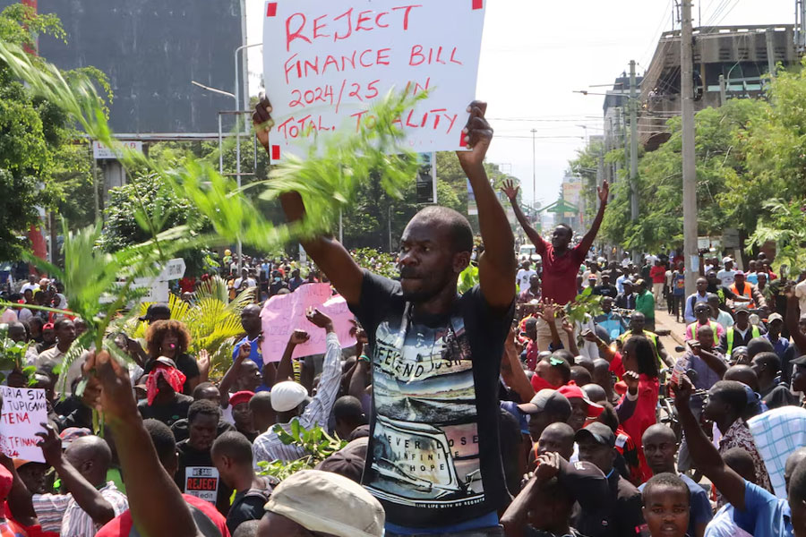 Protesters react during a demonstration against Kenya's proposed finance bill 2024/2025 in Kisumu town, Kenya, June 20, 2024.
