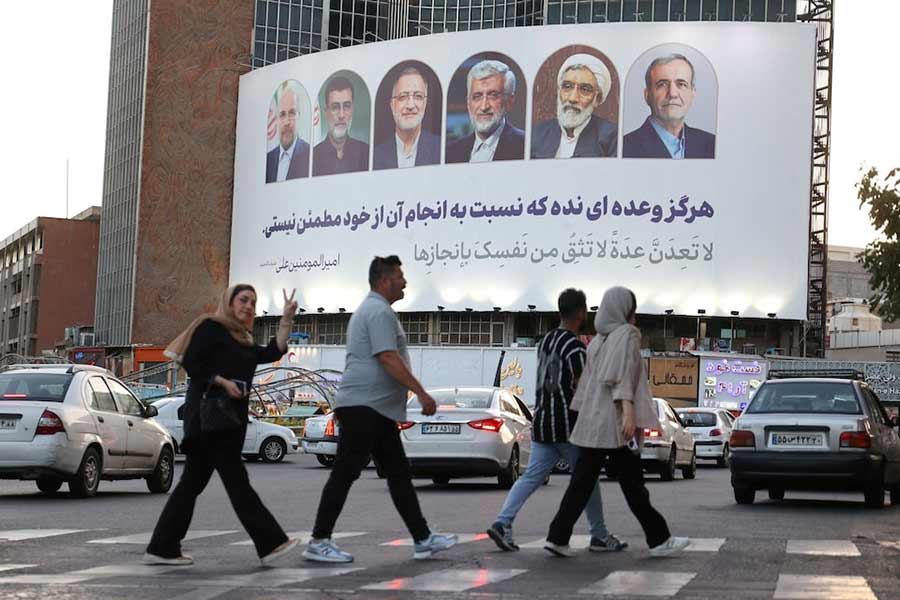 A billboard with pictures of the Iran’s presidential candidates is displayed on a street in Tehran recently –Reuters photo