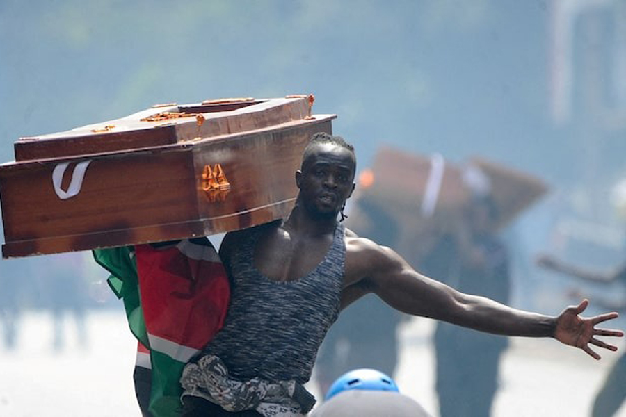 A protester carries a casket during a demonstration over police killings of people protesting against the imposition of tax hikes by the government, in Nairobi, Kenya, July 2, 2024.