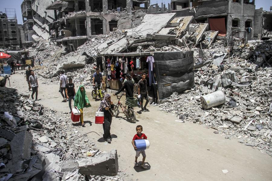 Palestinians walk in a market of the Jabalia refugee camp in the northern Gaza Strip, on June 20, 2024 — Xinhua photo