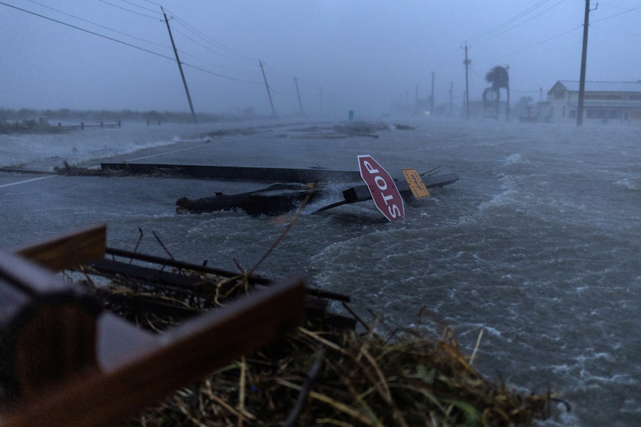 Debris and flood waters from Hurricane Beryl cover the main roadway in Surfside Beach, Texas, US