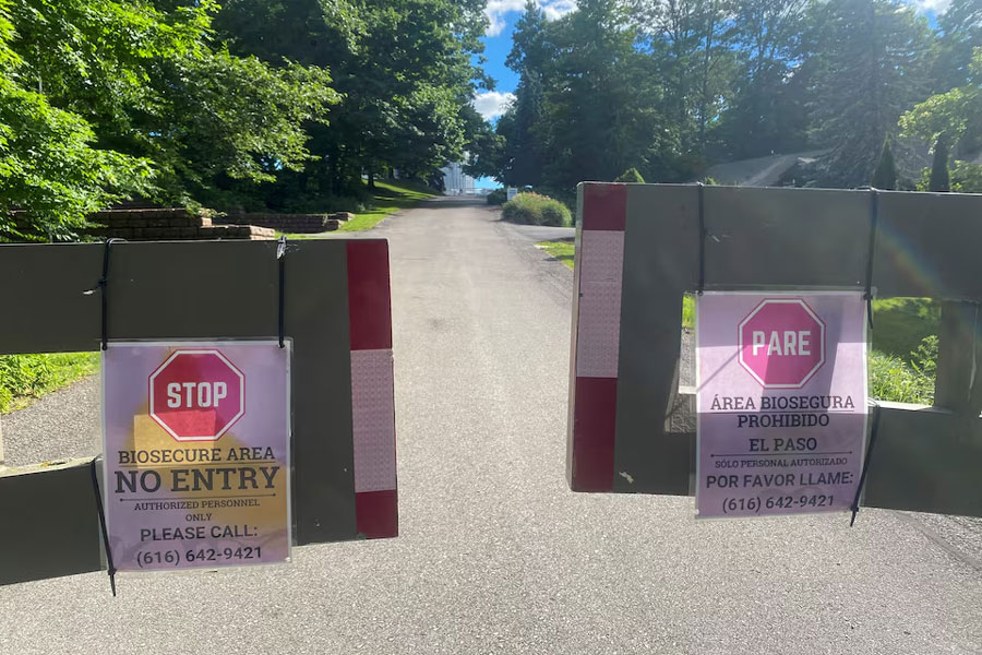 Warning signs are placed at an entry to egg producer Herbruck's farm in Ionia County, Michigan, U.S., June 6, 2024.