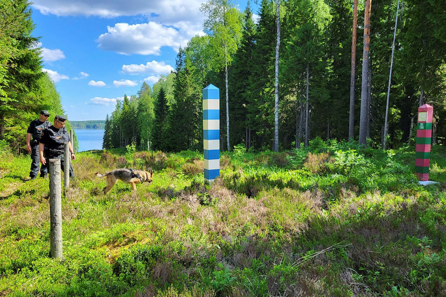 Finnish border guards and their dog Nita patrol the Finnish-Russian border