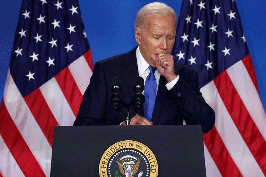 US President Joe Biden coughs at a press conference during NATO’s 75th anniversary summit, in Washington, US, July 11, 2024.
