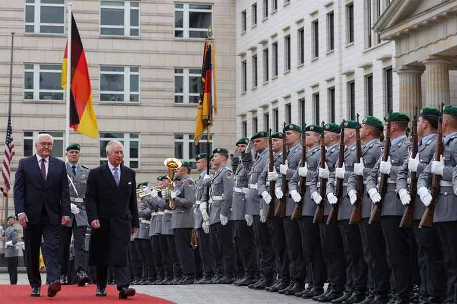 Britain's King Charles III and German President Frank-Walter Steinmeier reviewing an honour guard during a ceremonial welcome at Brandenburg Gate in Berlin on Wednesday -Reuters photo
