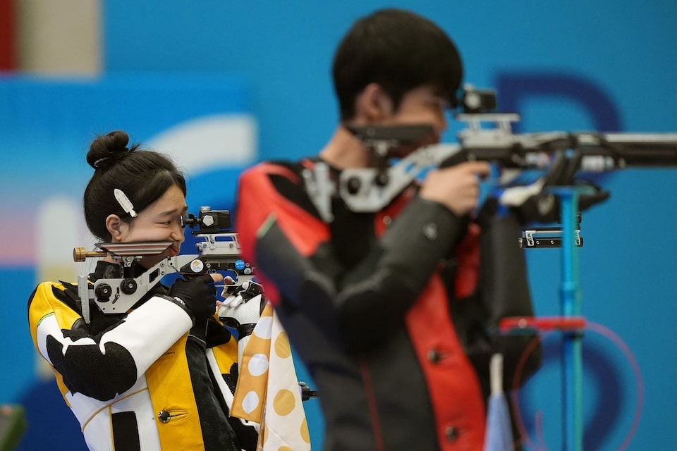 Yuting Huang (L) of China and Lihao Sheng of China in action during Paris 2024 Olympics Shooting competition at Chateauroux Shooting Centre, Dols in France on July 27, 2024 — Reuters photo