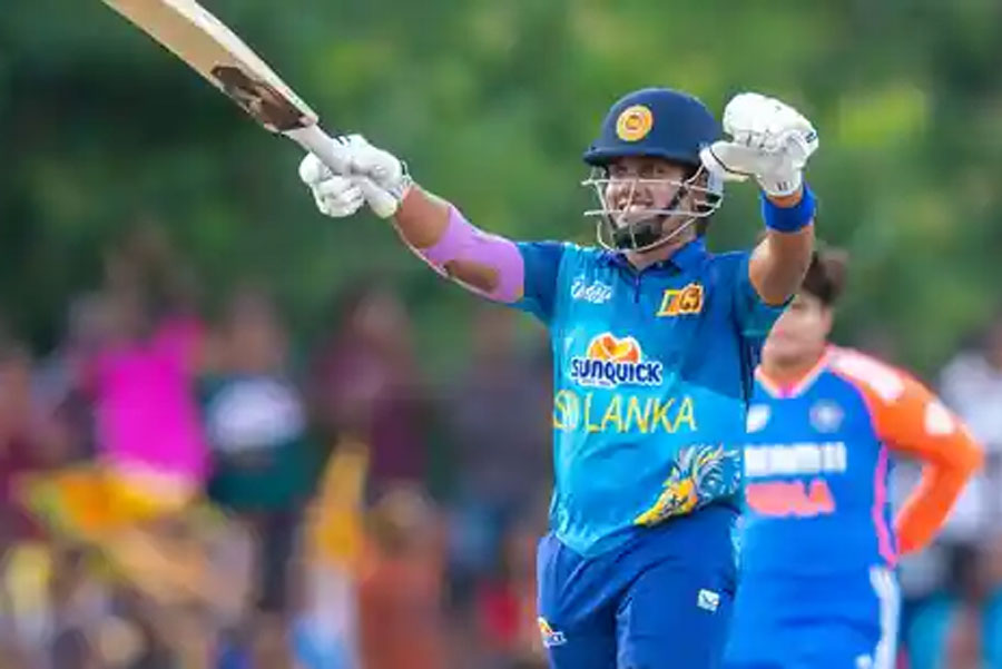 Sri Lanka's captain Chamari Athapaththu celebrates her half century during the Women's Asia Cup final T20 International cricket match between India and Sri Lanka, in Dambulla, Sunday