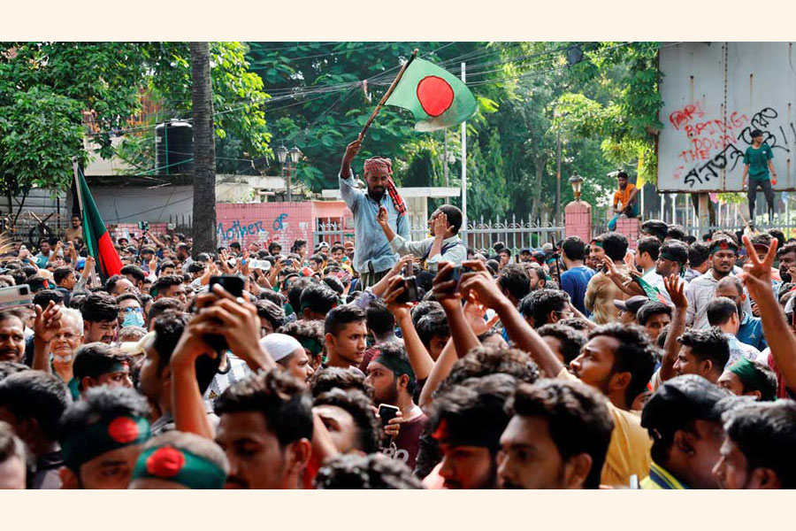 People celebrate the resignation of Prime Minister Sheikh Hasina in Dhaka on August 5, 2024