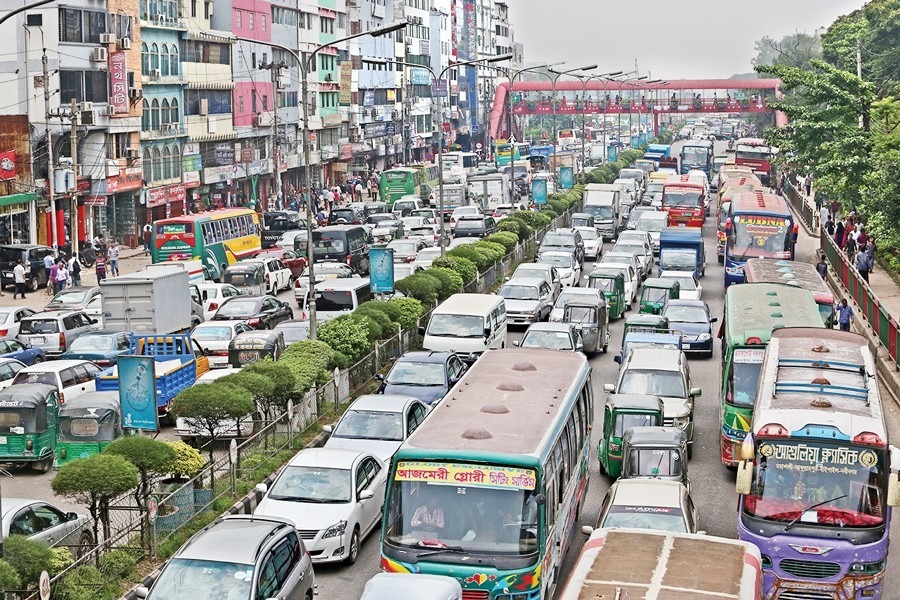 Demonstrators from various backgrounds bring Dhaka traffic to a standstill on Sunday. The protest, by village police among others, caused major disruption in Kakrail area. —FE Photo by Asad-Uz-Zaman