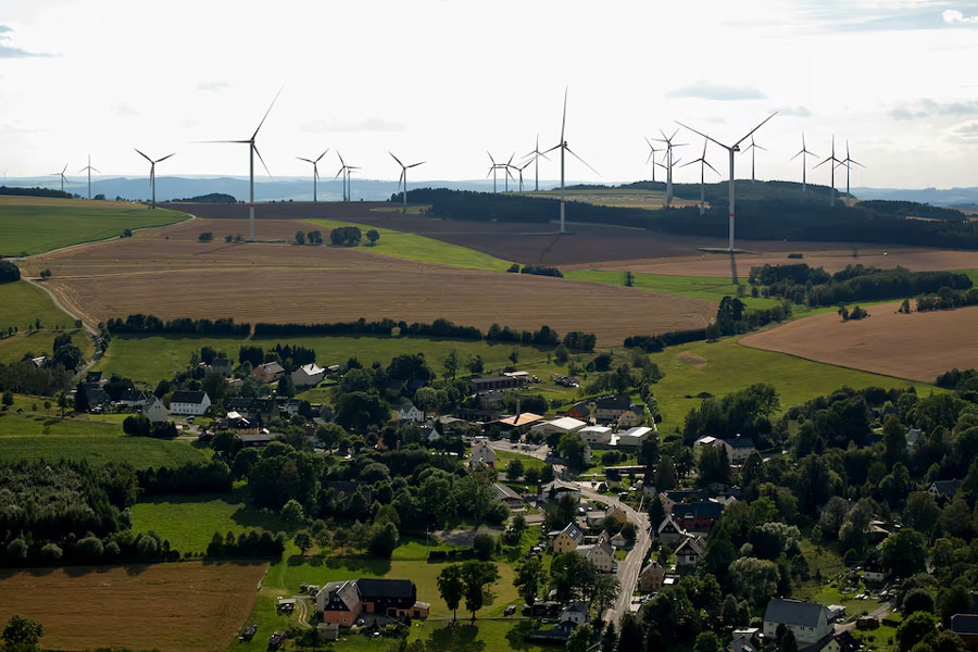 A view shows a wind farm behind Voigtsdorf near Dorfchemnitz, Germany, August 9, 2024.