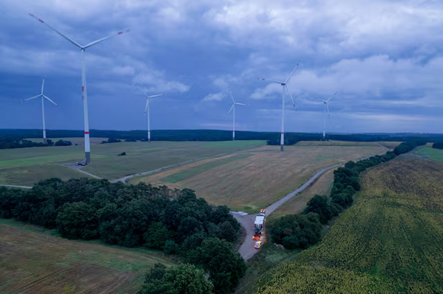 A view shows a nacelle of a wind turbine on a truck for heavy haulage being transported near a wind farm, in Biegen, Germany August 31, 2023.
