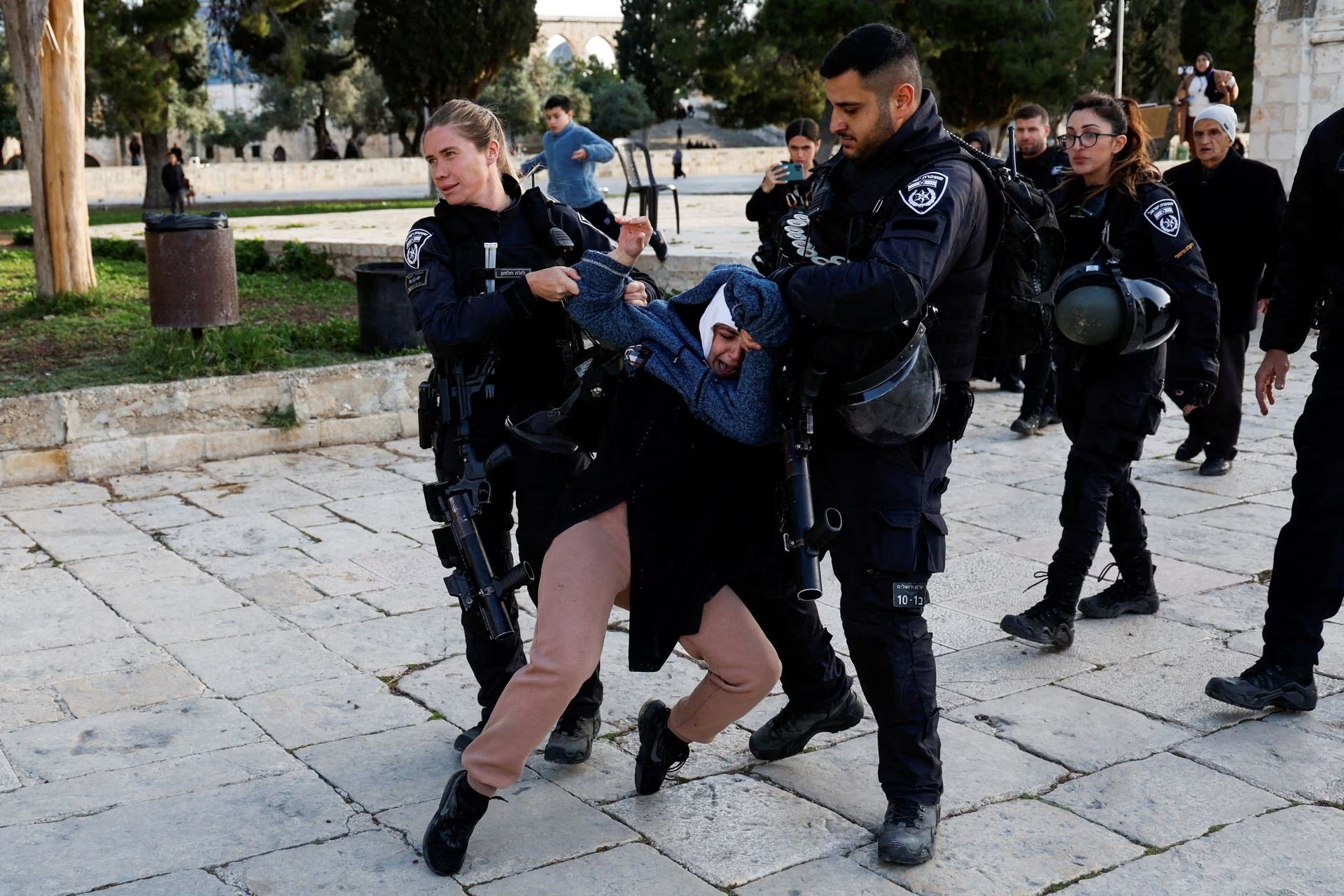 Israeli border police detain a woman at the Al-Aqsa compound, also known to Jews as the Temple Mount, while tension arises during clashes with Palestinians in Jerusalem's Old City on April 5, 2023 — Reuters photo