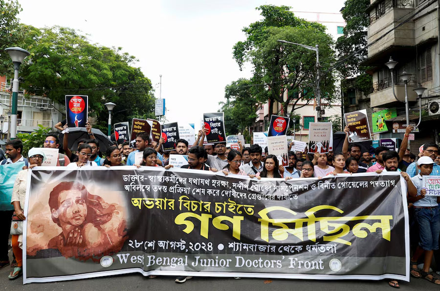 Members of the West Bengal Junior Doctors' Front march along a street during a protest condemning the rape and murder of a trainee medic at a government-run hospital, in Kolkata, India, August 28, 2024.