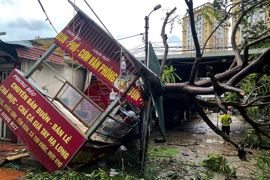A man walks past a devastated area following the impact of Typhoon Yagi, in Hanoi, Vietnam, September 8, 2024.