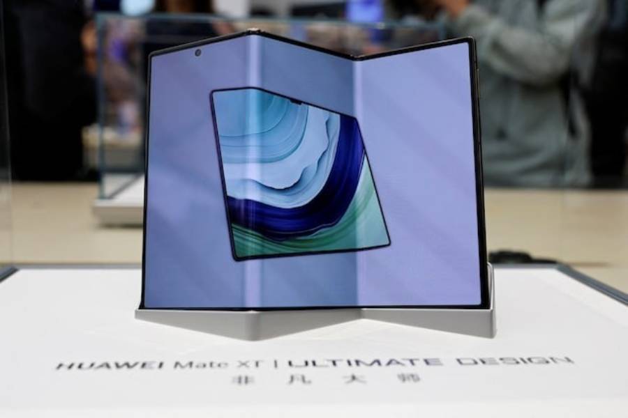 Huawei's new tri-foldable smartphone Mate XT is seen displayed in a glass case at a Huawei flagship store in Beijing, China September 10, 2024.