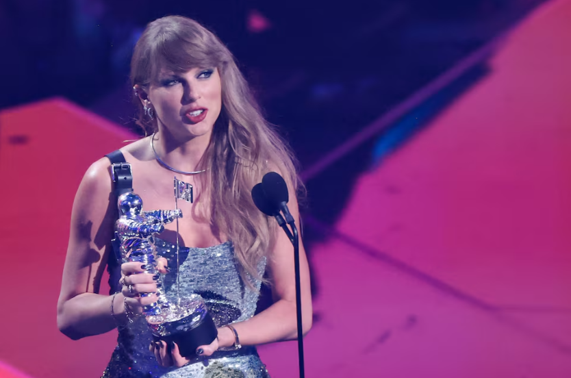Taylor Swift accepts the award for Video of the Year for "Fortnight". REUTERS/Brendan Mcdermid