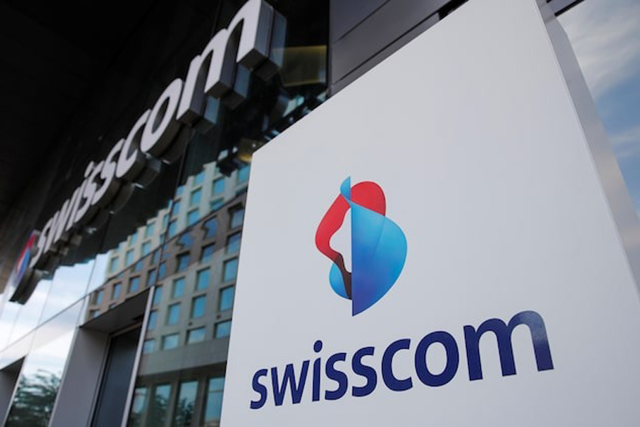 The logo of Swiss telecoms group Swisscom is seen at an office building, in Zurich, Switzerland May 26, 2020.