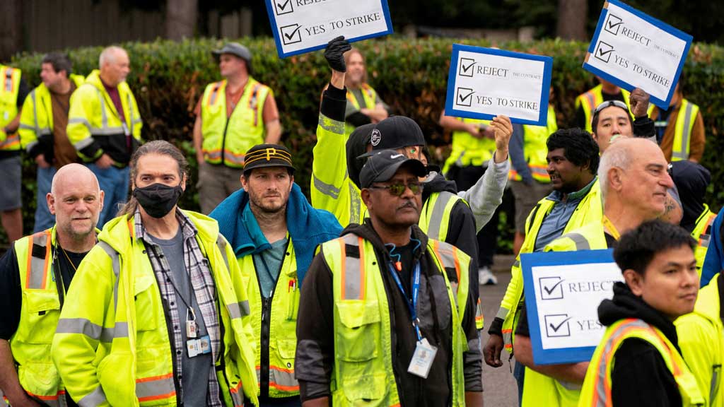 Boeing factory workers hold signs as they wait to vote on their first full contract in 16 years, at an International Association of Machinists and Aerospace Workers District 751 union hall, in Renton, Washington, US Sept 12, 2024. REUTERS/David Ryder 03