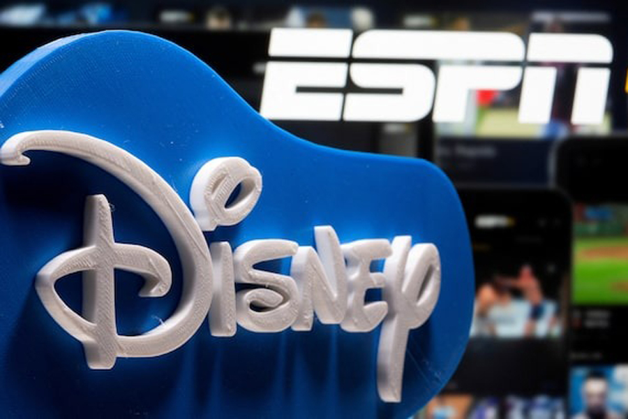 A 3D printed Disney logo is seen in front of the ESPN+ logo in this illustration taken on July 13, 2021.