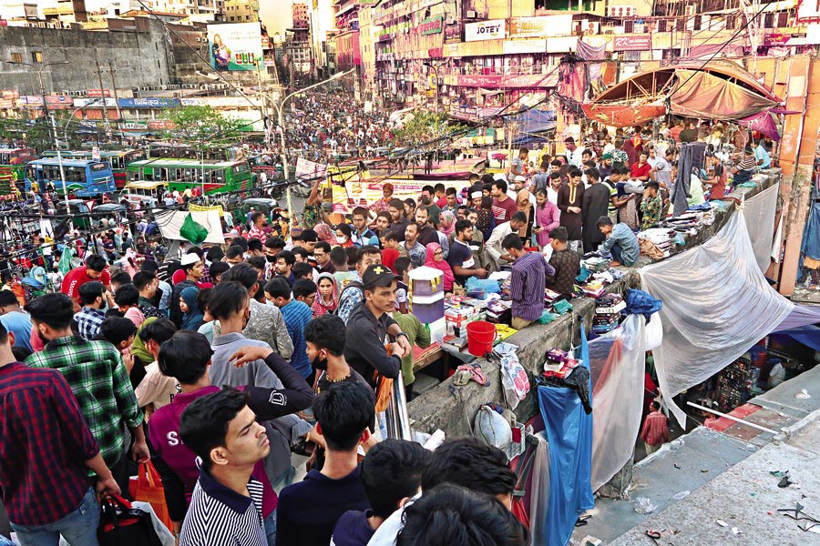 Shoppers throng the New Market area, a major shopping hub in the city, on Friday to buy new dresses as Eid-ul Fitr is drawing closer — FE Photo by Shafiqul Alam
