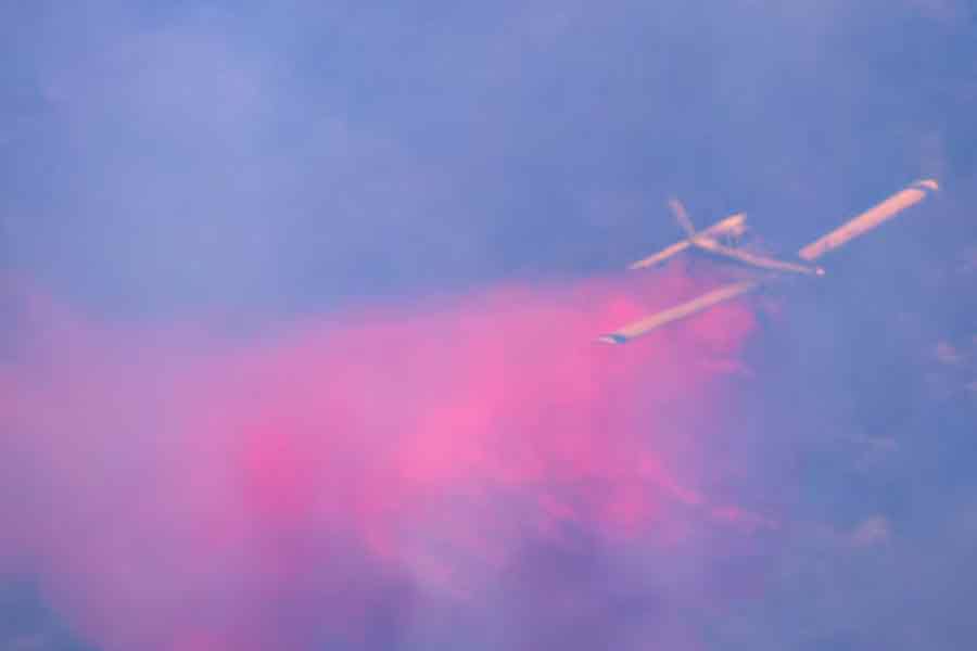 Firefighter plane dropping fire retardant on burning trees as it flies through smoke, amid cross-border hostilities between Hezbollah and Israel, in northern Israel, on Wednesday -Reuters photo