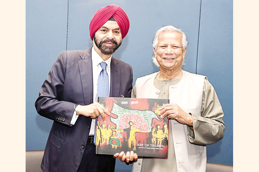 Chief Adviser Prof Dr Mohammad Yunus hands over an art book 'Art of Triumph' to World Bank President Ajay Banga at the UN Headquarters on Thursday. The book portrays the graffiti drawn by Bangladeshi students after the July-August revolution. — PID