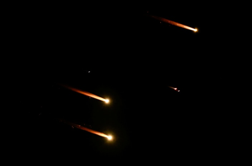 Rockets fly in the sky as seen from Tel Aviv, Israel, October 1, 2024. REUTERS/Ammar Awad