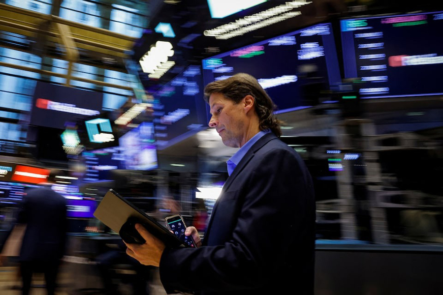 Traders work on the floor at the New York Stock Exchange (NYSE) in New York City, US, September 19, 2024.